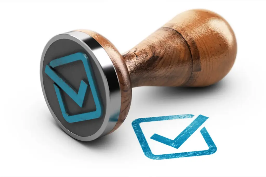 Check-mark-and-rubber-stamp-over-white-background-2024-10-11-19-22-41-utc-scaled